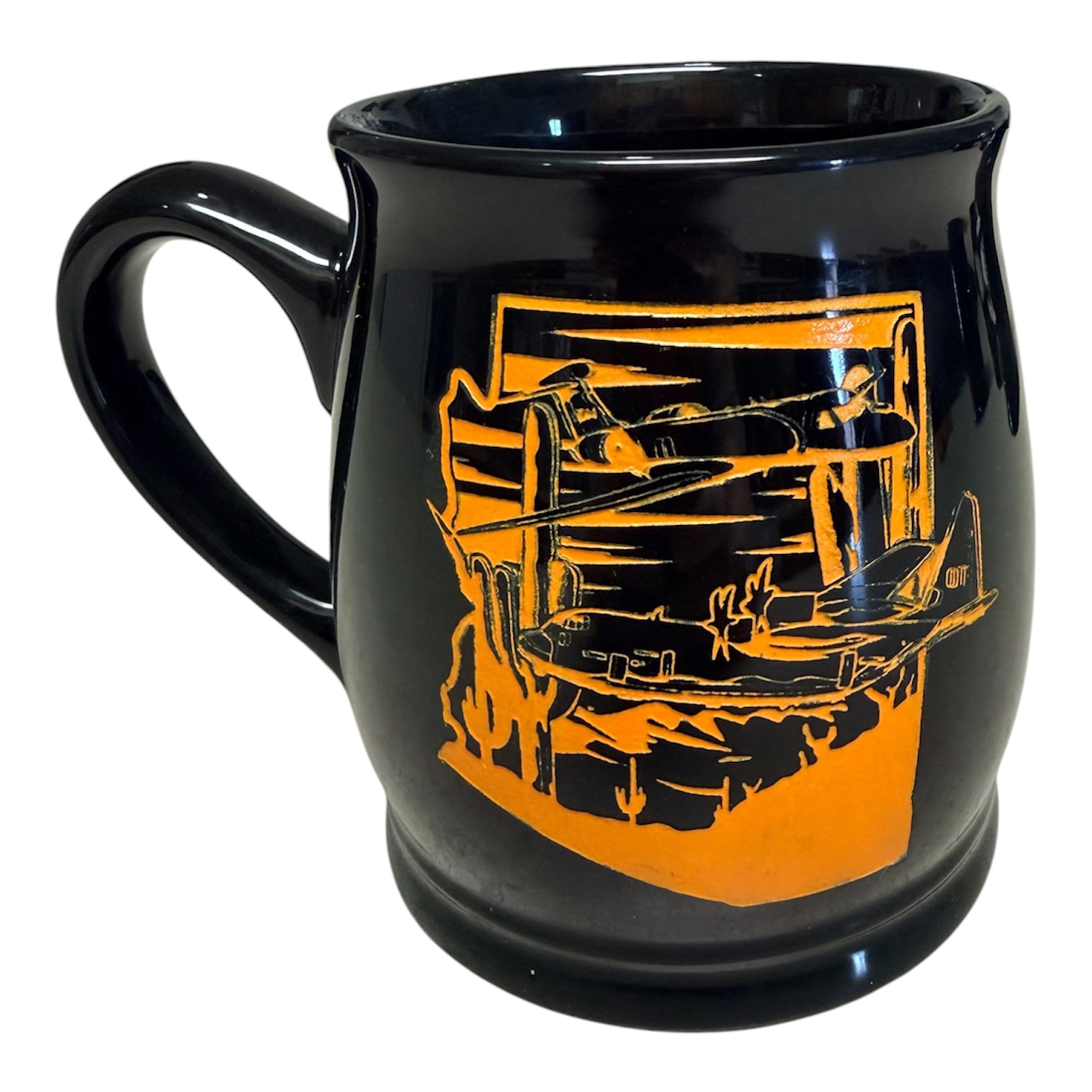 Black cup with orange aircraft artwork