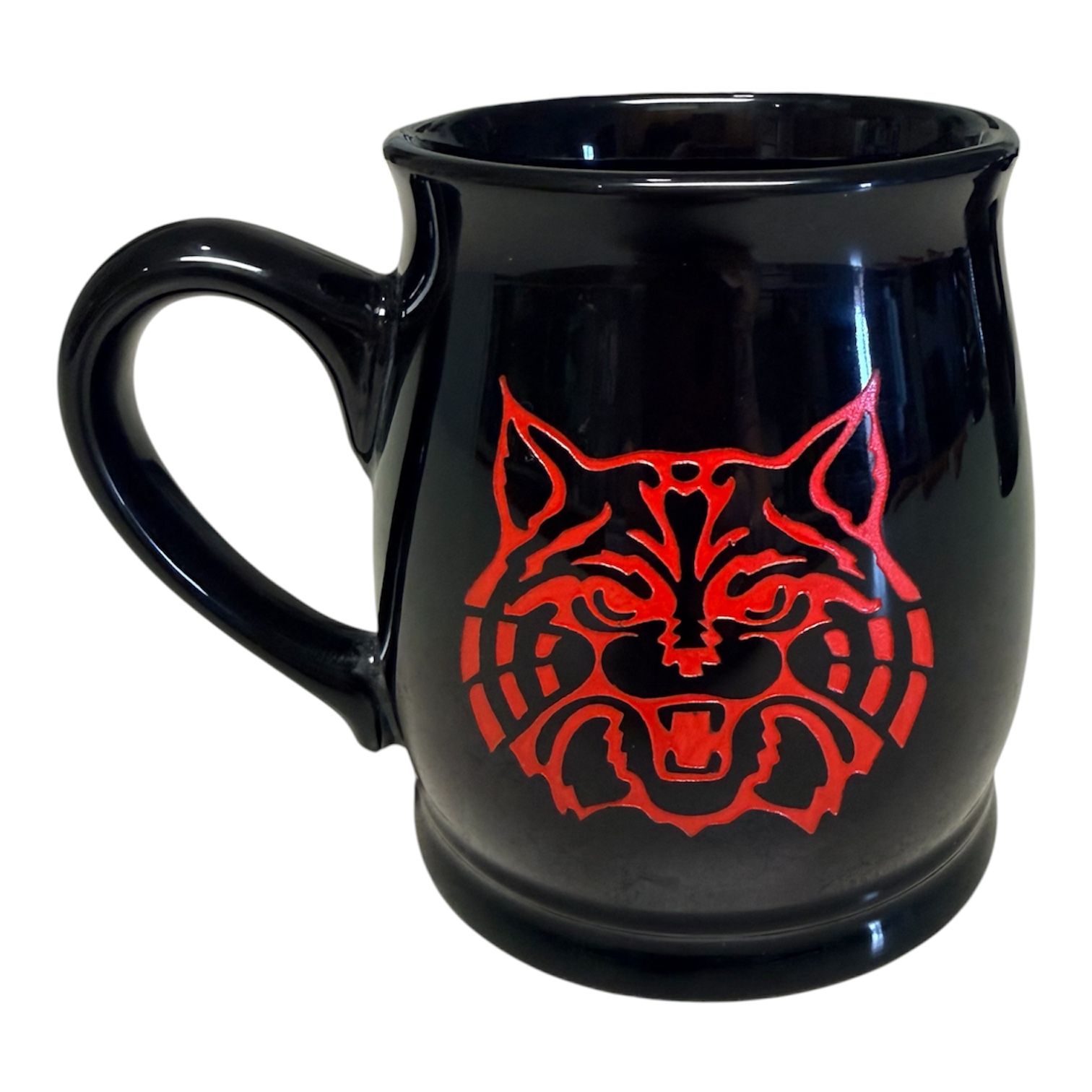 Black cup with red wildcat logo artwork