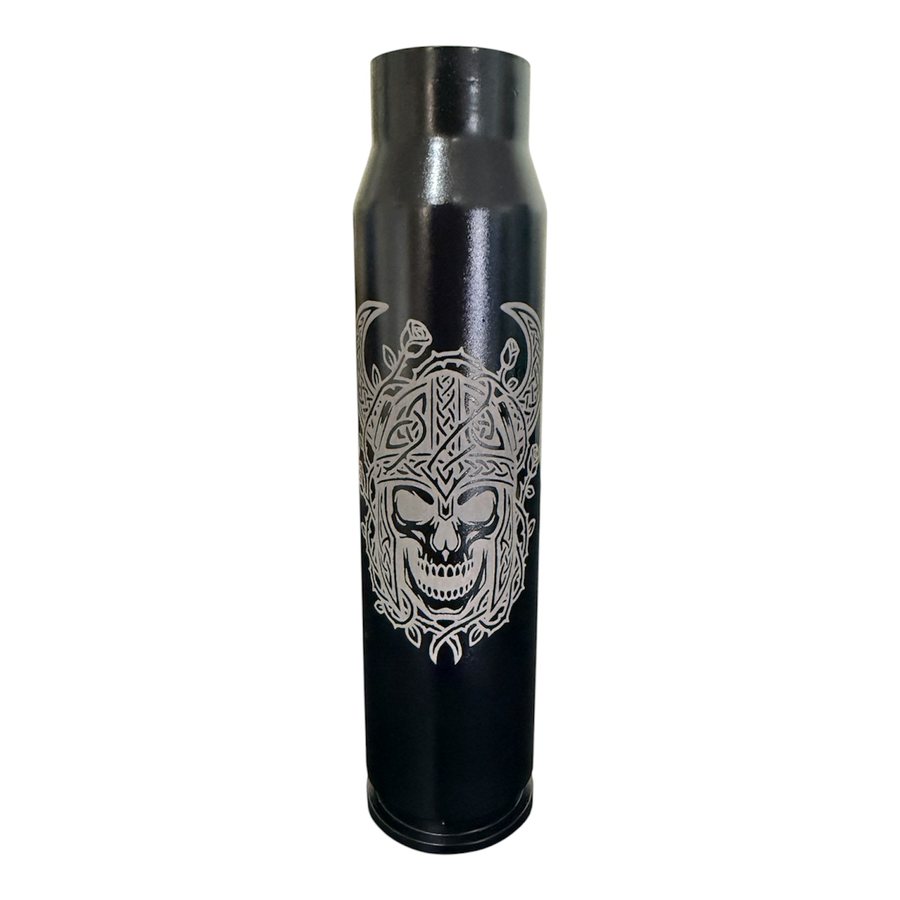 Black A-10 30mm shell engraved with an ornate skull design