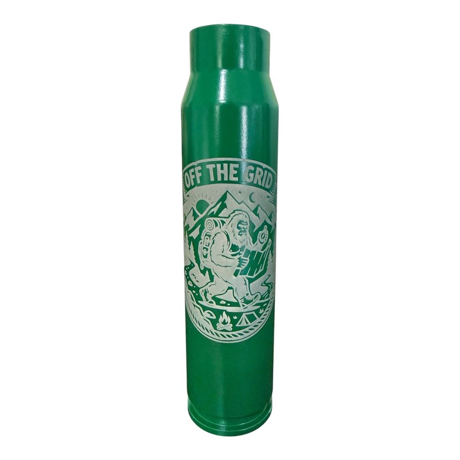 Green A-10 30mm shell engraved with an Off the Grid outdoor design