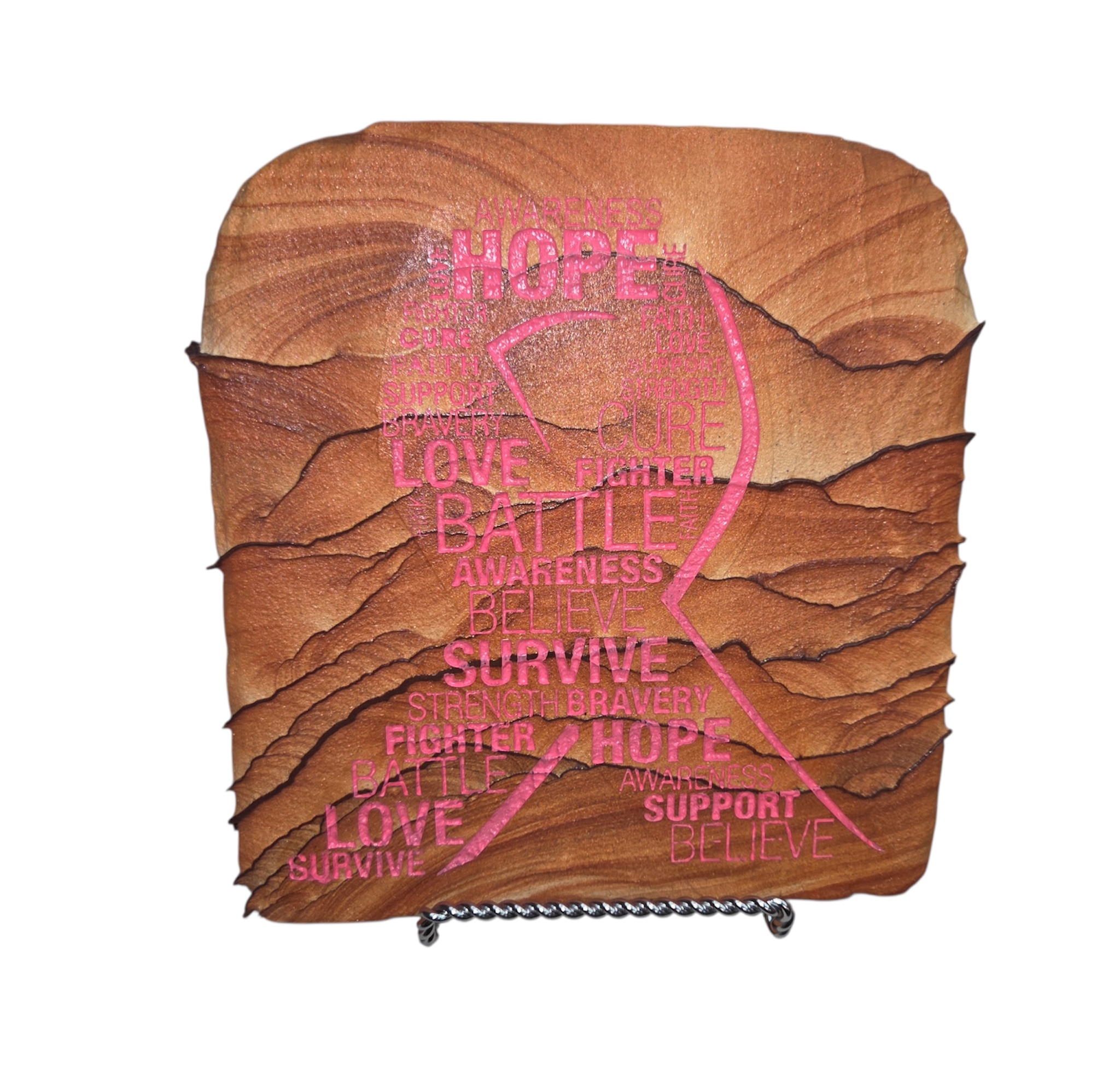 Arizona sandstone awareness piece with pink ribbon and words including hope, love, battle, and survive
