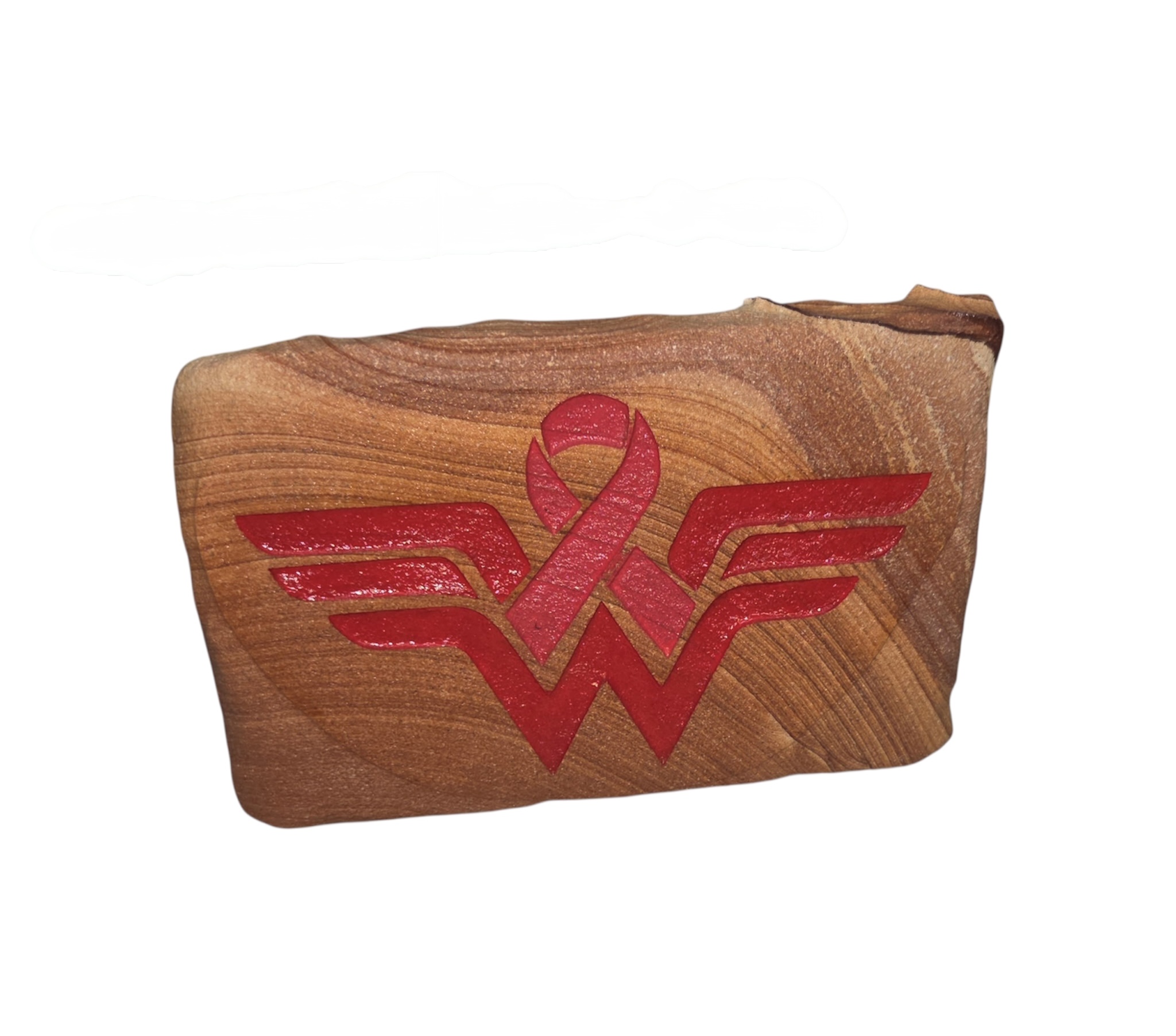 Arizona sandstone awareness piece with red ribbon and wing-inspired emblem
